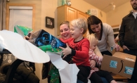 Trina Lawrence and her kids unwrap presents from Best Christmas Ever.