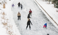 Skaters on the ice at Centennial Lakes Park.