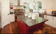  Red kitchen accents are among the many stylish design elements of this urban farmhouse by Refined, LLC.