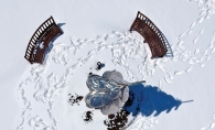 An overhead shot of a sculpture and benches in Centennial Lakes Park in Edina