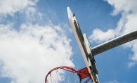 A boy shoots a basketball at Cornelia Field Day