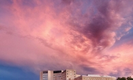 A pink sky after a storm hangs over the Fairview Southdale Hospital.