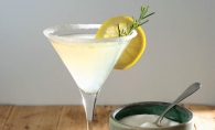 Lemon Drop martini with rosemary simple syrup and garnish.