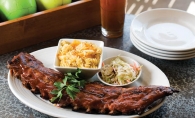 Rack it up with a platter of baby back ribs and a game of bocce ball at Pinstripes.