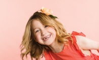 A young girl models Heartfelt Blooms' felt floral designs