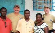 James Harding, left, and Tom Schmitz, right, with LNFS trainers in Liberia.