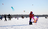 A child flies a kite at the Lake Harriet Kite Festival