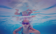A girl swims underwater at the Edina Pool in Melissa Hunzelman's photograph "Little Fish"