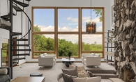 Living Room by Puustelli USA Puustelli USA living room design featuring natural stone fireplace.
