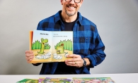 Author Derek Anderson holding up his book 'Croc and Ally'