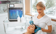 A woman receives a hydrafacial to combat sun damage.