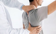 A chiropractor works on a patient's back at Chiropractic Health & Wellness