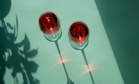 Red wine glasses reflecting light