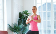 A woman poses while doing therapeutic yoga.