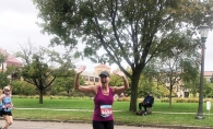 Strohkirch during the 2021 Twin Cities Marathon, waving to her daughters.
