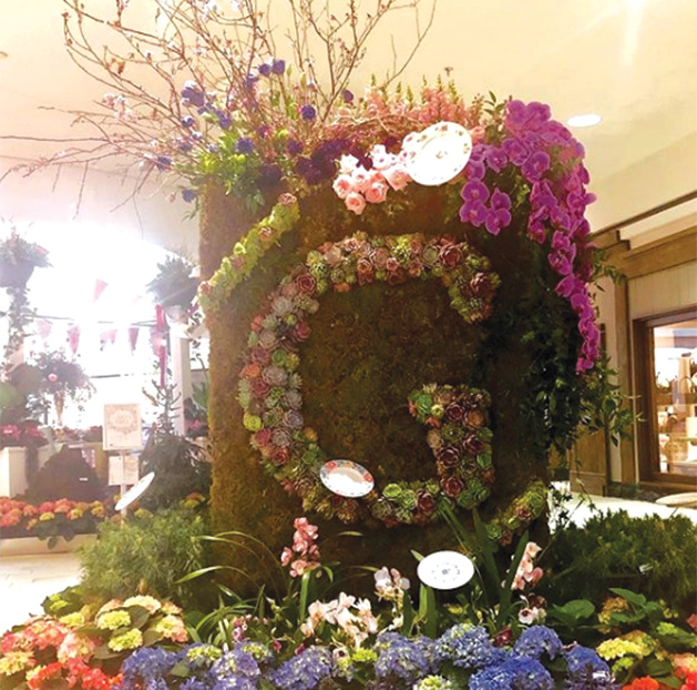 A "G" made of flowers at the Galleria Garden Party
