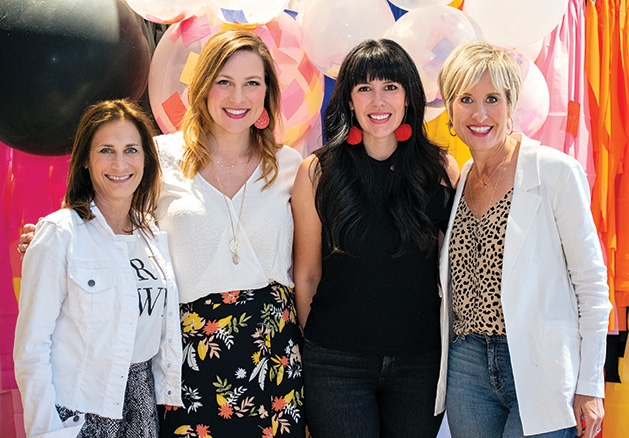 HGTV's Heather Fox, Evereve founder Megan Tamte and two other influencers pose for a photo at the Evereve Minneapolis Influencer Social.