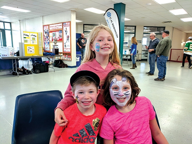Three children with painted face at the 2019 Big Futures Tournament and Family Festival.
