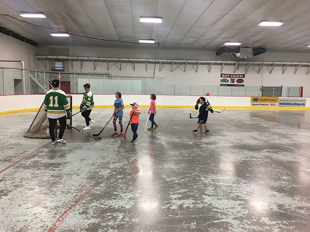 Hockey players on the ice at the 2019 Big Futures Tournament and Family Festival.