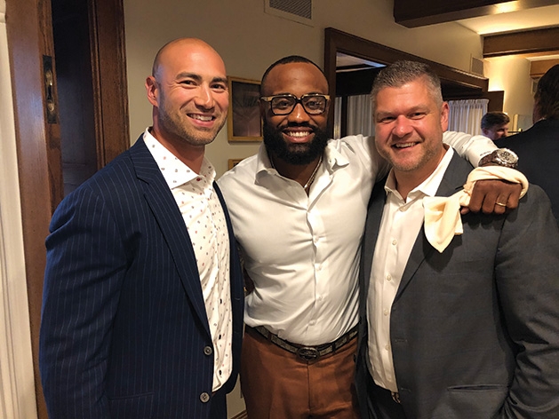 Ben Leber, Everson Griffen and another man at Taste Fore the Tour