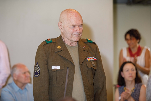 A veteran stands at the Edina Veterans Dinner