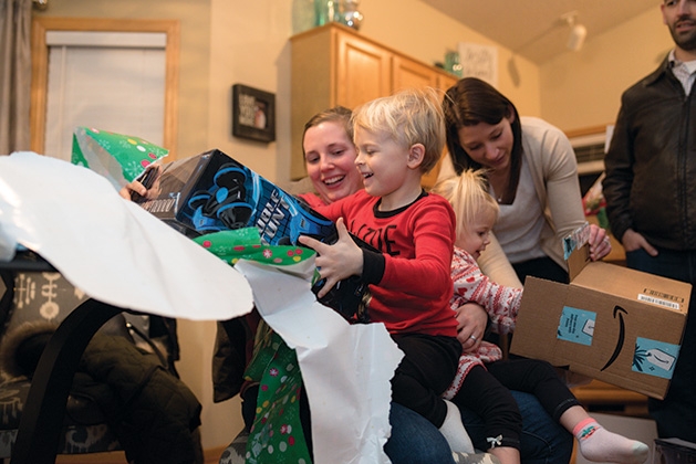 Trina Lawrence and her kids unwrap presents from Best Christmas Ever.