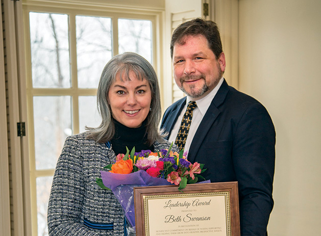 Beth Swanson, pictured with her husband James, was presented with a Connecting with Kids Leadership Award by the Edina Community Foundation