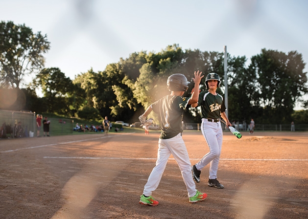 Edina baseball players celebrate.