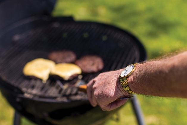 Man grilling hamburgers