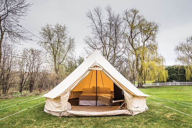 Pitch a glamping tent in your backyard.