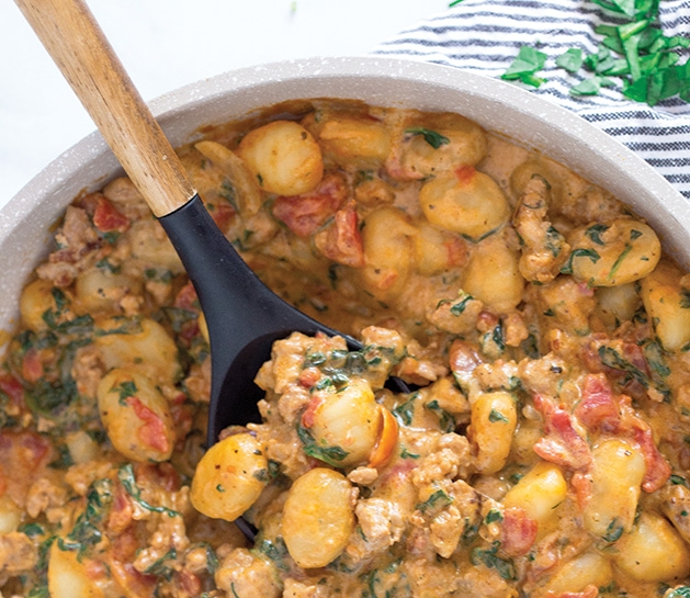 Creamy sausage and spinach gnocchi, a one skillet recipe from Greens N Chocolate.