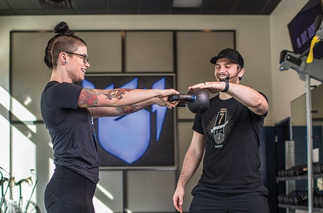Basecampe Fitness Edina A woman goes through high-intensity interval training at Basecamp Fitness in Edina.