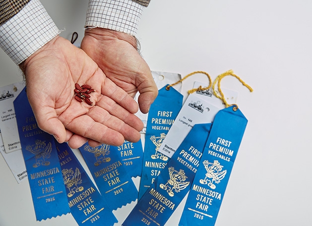Russell Stanton Russell Stanton holds seeds for his Minnesota State Fair blue ribbon-winning squash