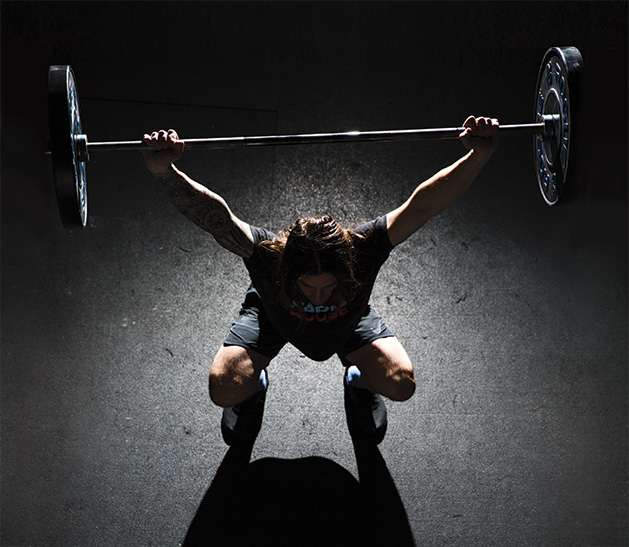 Farmhouse Performance Lab founder Addison Bain lifts weights