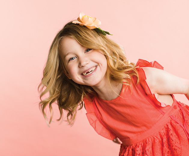 A young girl models Heartfelt Blooms' felt floral designs