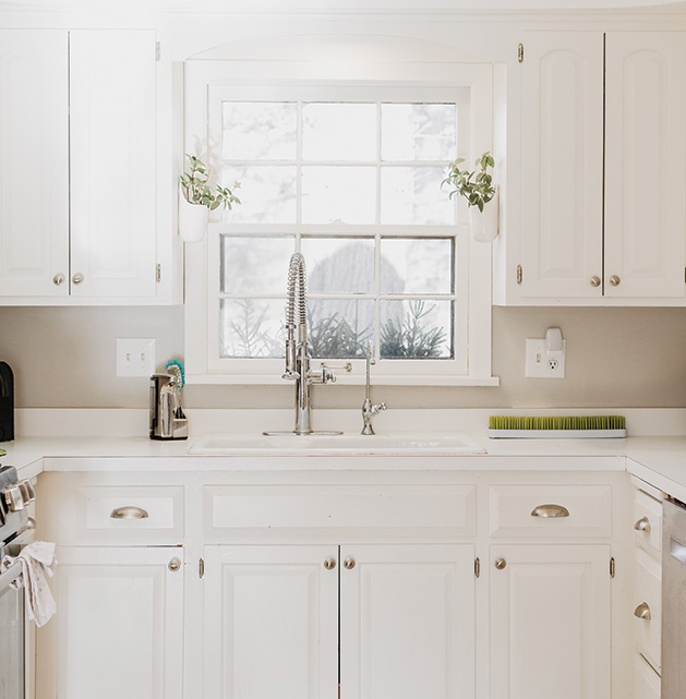 A white, clean kitchen.