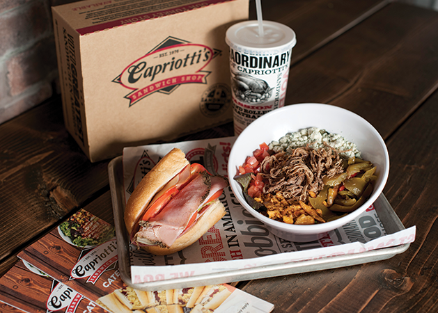 A sub sandwich, salad and soda from Capriotti's in Edina