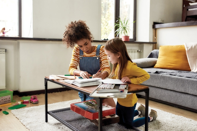 Babysitter with a young girl.