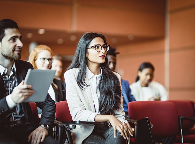 A woman attends the Living and Leading a Purposeful Life event hosted by the Edina Chamber of Commerce