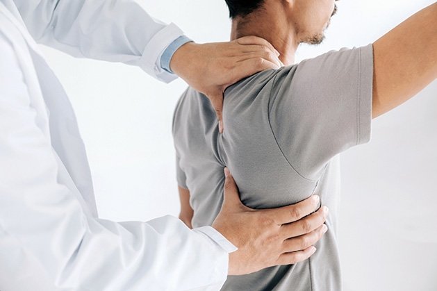 A chiropractor works on a patient's back at Chiropractic Health & Wellness