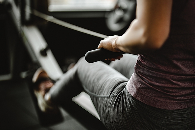 Woman using exercise equipment