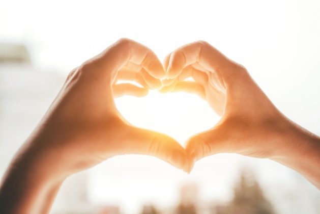 Women's hands forming a heart