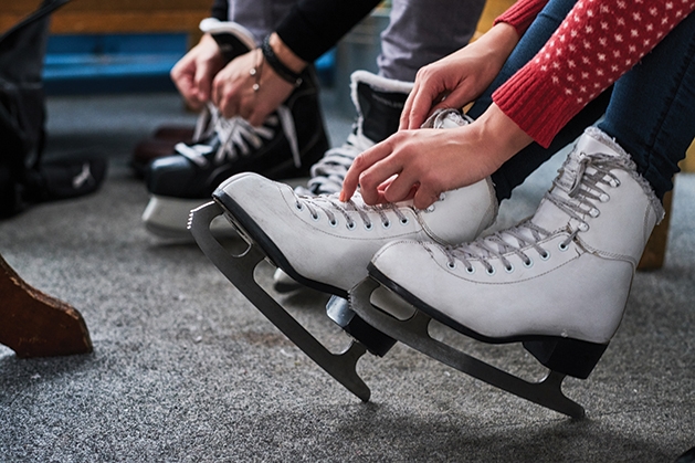 putting on ice skates