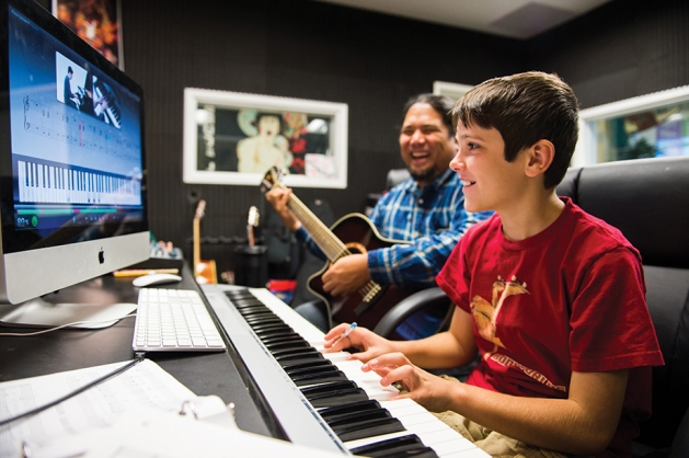 Young boy in a music lesson.