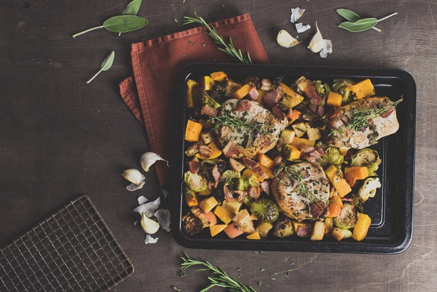 Sheet pan with pork chops, brussels sprouts and squash. 