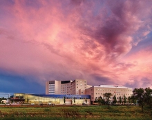 A pink sky after a storm hangs over the Fairview Southdale Hospital.