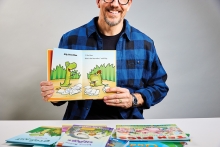 Author Derek Anderson holding up his book 'Croc and Ally'