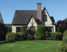 A newly remodeled home with a manicured lawn.