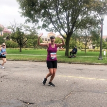 Strohkirch during the 2021 Twin Cities Marathon, waving to her daughters.
