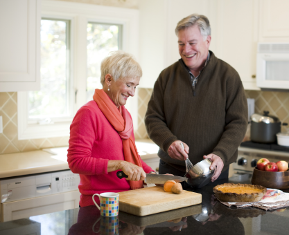 Terri Peterson and husband cook